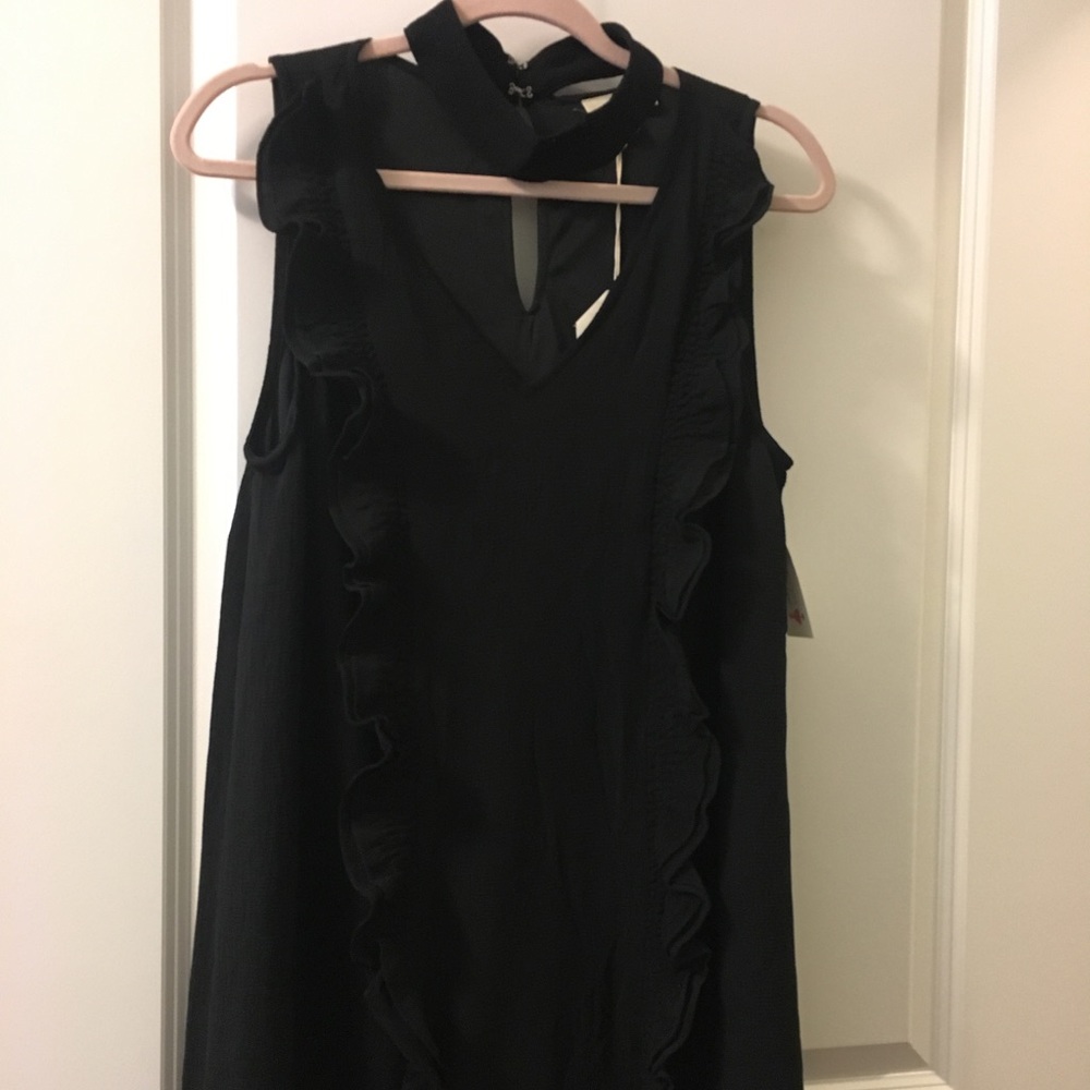 Black sleeveless ruffle dress with choker collar